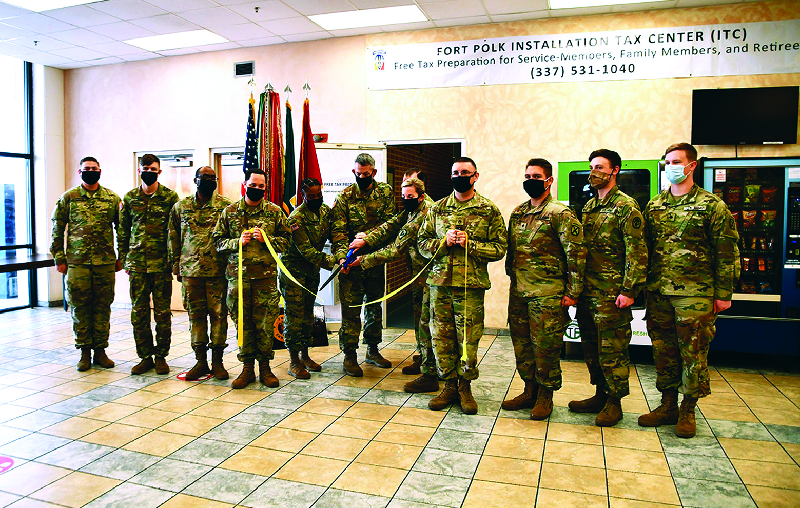 On 22 January 2021, the Joint Readiness Training Center and Fort Polk OSJA hosted the installation tax center ribbon-cutting ceremony. The Commanding General, BG David Doyle joined in celebrating the tax center being open for business. The ribbon was cut by the tax center OIC, CPT Jenekwa Harrison (left), the Commanding General, BG David Doyle (center), and the Staff Judge Advocate, COL Tiffany Chapman (right). Also pictured are Soldiers that will assist in preparing taxes this year, each representing a unit assigned to Fort Polk. 